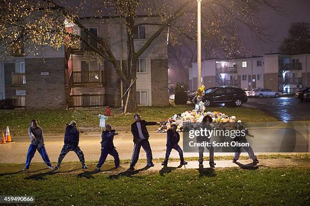 Young boys break dance near the Michael Brown memorial on November 23, 2014 in Ferguson, Missouri. Ferguson is struggling to return to normal after...