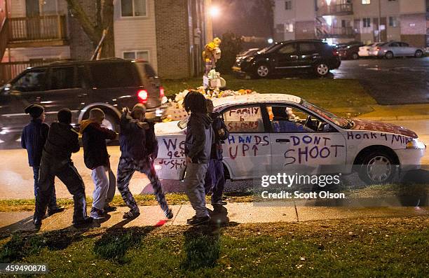 Young boys break dance near the Michael Brown memorial on November 23, 2014 in Ferguson, Missouri. Ferguson is struggling to return to normal after...