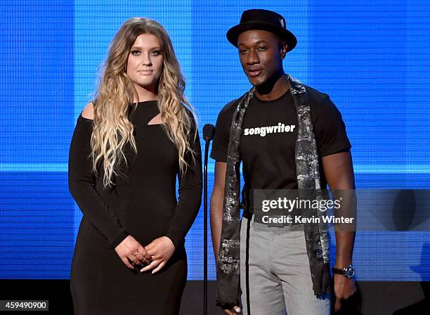 Recording artists Ella Henderson and Aloe Blacc speak onstage at the 2014 American Music Awards at Nokia Theatre L.A. Live on November 23, 2014 in...