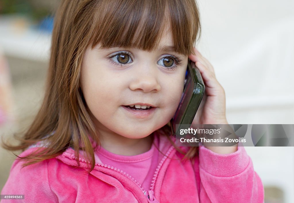 Small girl using a smartphone