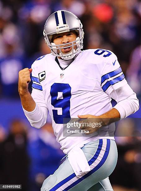 Tony Romo of the Dallas Cowboys celebrates throwing the game winning touchdown pass in the fourth quarter against the New York Giants at MetLife...