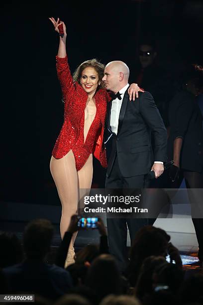 Recording artists Jennifer Lopez and Pitbull speak onstage during the 2014 American Music Awards held at Nokia Theatre L.A. Live on November 23, 2014...