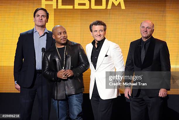 Businessmen/'Shark Tank' cast members Mark Cuban, Daymond John, Robert Herjavec, and Kevin O'Leary speak onstage at 2014 American Music Awards held...