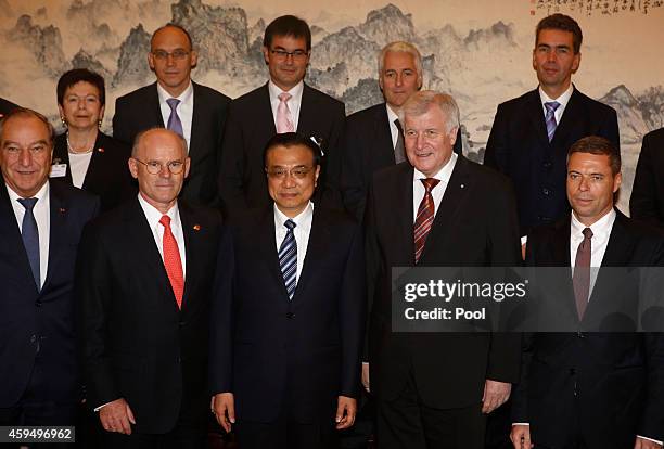 Chinese Premier Li Keqiang and Bavarian Prime Minister and leader of the Christian Social Union of Germany Horst Seehofer pose for a group photo with...