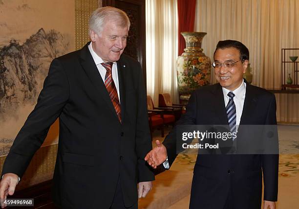 Bavarian Prime Minister and leader of the Christian Social Union of Germany Horst Seehofer introduces other members of German delegates to Chinese...