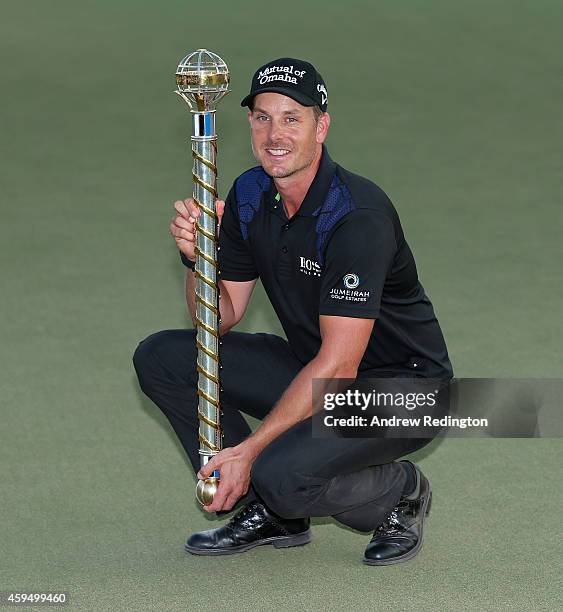 Henrik Stenson of Sweden poses with the trophy after winning the DP World Tour Championship at Jumeirah Golf Estates on November 23, 2014 in Dubai,...