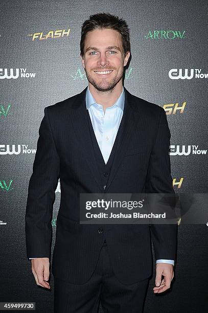 Stephen Amell arrives at a special screening for the CW's "Arrow" And "The Flash" at Crest Theatre on November 22, 2014 in Westwood, California.