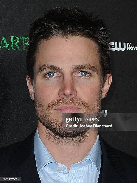 Stephen Amell arrives at a special screening for the CW's "Arrow" And "The Flash" at Crest Theatre on November 22, 2014 in Westwood, California.