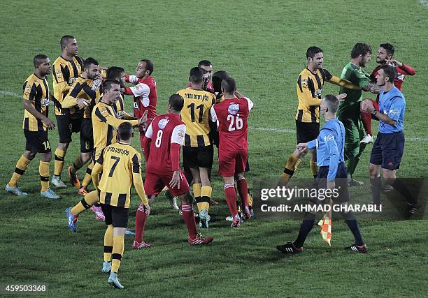 Football player from Bnei Sakhnin, the only Arab team in the Israeli Premier league, scuffles with a player from their mainly Jewish rivals Beitar...