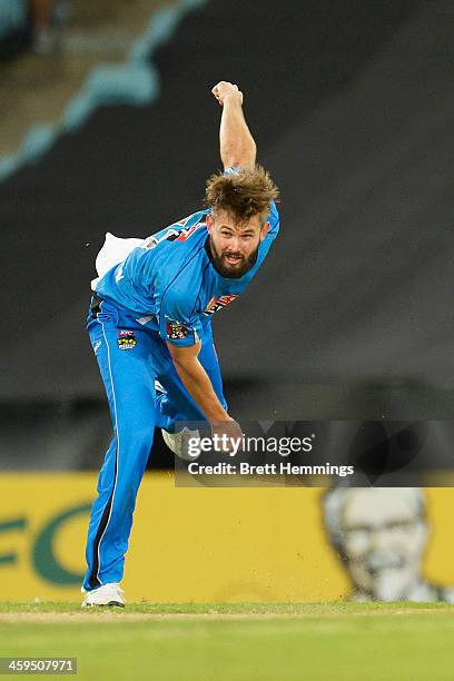 Kane Richardson of the Strikers bowls during the Big Bash League match between Sydney Thunder and the Adelaide Strikers at ANZ Stadium on December...