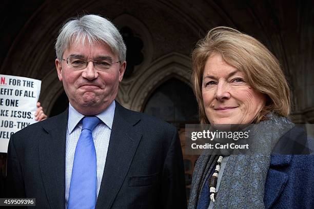 Andrew Mitchell and his wife Dr Sharon Bennett arrive at the High Court on November 24, 2014 in London, England. Former cabinet minister Andrew...