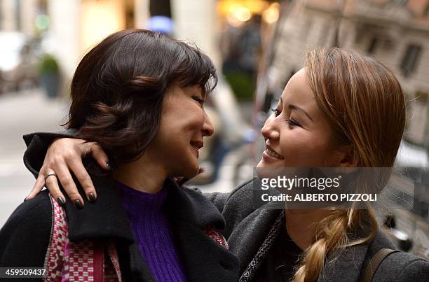 Alma Shalabayeva is welcomed by her daughter Madina as she arrives for a press conference after she arrived in Rome on December 27, 2013....