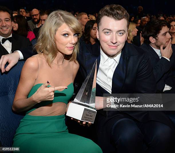 Taylor Swift and Sam Smith attend the 2014 American Music Awards at Nokia Theatre L.A. Live on November 23, 2014 in Los Angeles, California.