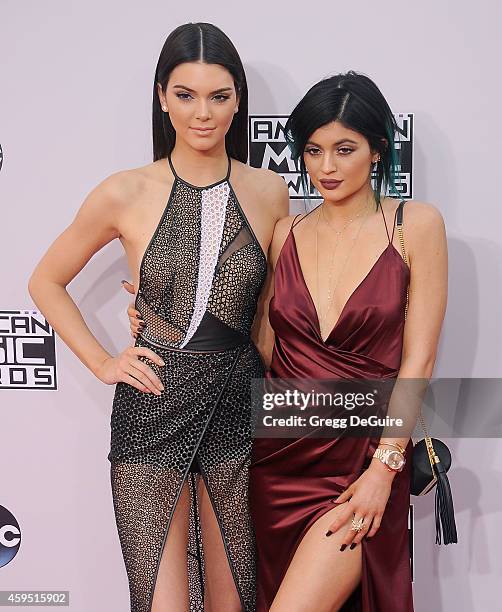 Kendall Jenner and Kylie Jenner arrive at the 2014 American Music Awards at Nokia Theatre L.A. Live on November 23, 2014 in Los Angeles, California.