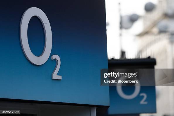 Bt O2 Logo O2 logos sit on display above the entrance to a mobile phone store ...