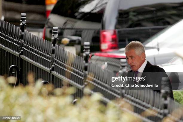 Secretary of Defense Chuck Hagel arrives beforea press conference with President Barack Obama to announe Hagel's resignation at the White House...