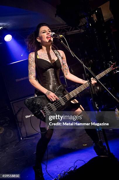 Bassist Vikki Spit of English glam metal group Spit Like This performing live on stage at the 2013 Hard Rock Hell festival in Pwllheli, Wales, on...