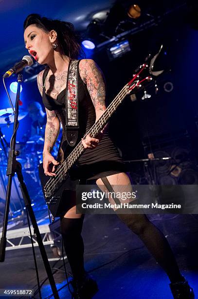 Bassist Vikki Spit of English glam metal group Spit Like This performing live on stage at the 2013 Hard Rock Hell festival in Pwllheli, Wales, on...