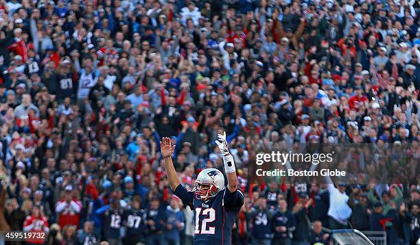 Patriots quarterback Tom Brady leads the cheers after running back LeGarrette Blount, not pictured, scored a second quarter touchdown. The New...