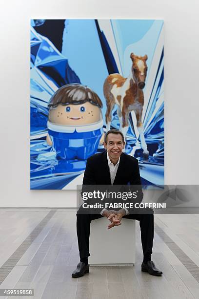 Artist Jeff Koons poses in front of "Boy with Pony" on May 11, 2012 during an exhibition preview of his work at the Fondation Beyeler museum in...