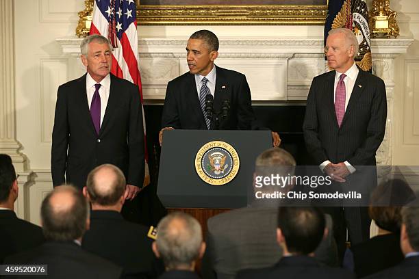 President Barack Obama speaks as Secretary of Defense Chuck Hagel and Vice President Joe Biden look on during a press conference announcing Hagel's...