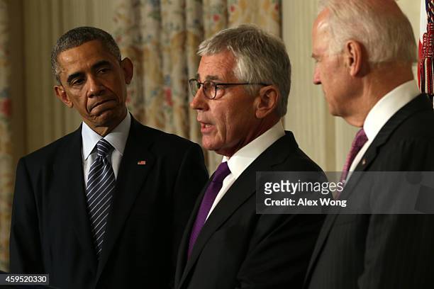 Secretary of Defense Chuck Hagel speaks as President Barack Obama and Vice President Joe Biden look on during a press conference announcing Hagel's...