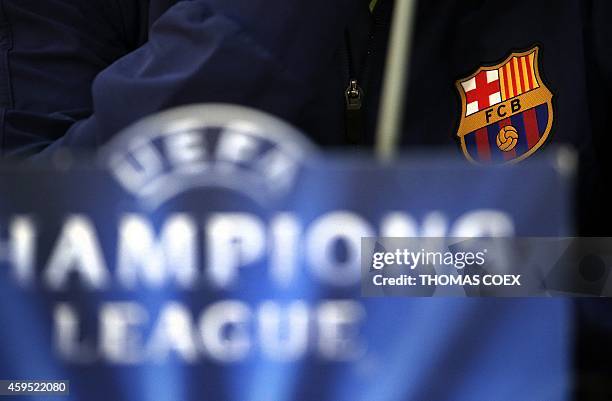 The logo of Barcelona FC is seen on the vest of Croatian midfielder Ivan Rakitic during a press conference at the GSP Stadium in the Cypriot capital...