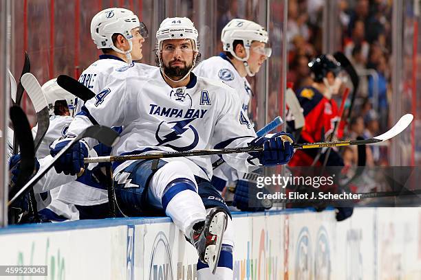 Nate Thompson of the Tampa Bay Lightning sits on the boards during a break in the action against the Florida Panthers at the BB&T Center on December...