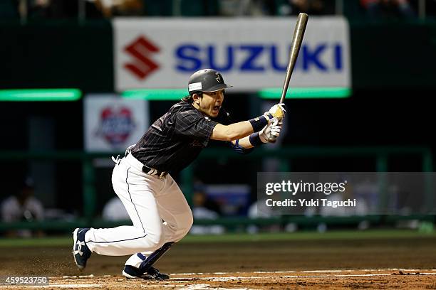 Nobuhiro Matsuda of Samurai Japan hits a single in the second inning during the game against the MLB All-Stars at Okinawa Cellular Stadium during the...