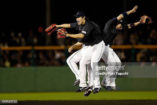 Members of Samurai Japan celebrate defeating the MLB All-Stars at Okinawa Cellular Stadium during the Japan All-Star Series on November 20, 2014 in...