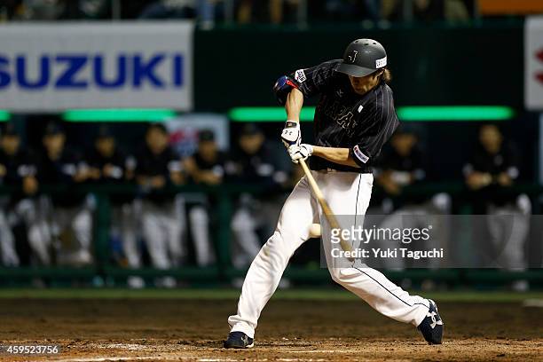 Yuki Yanagita of Samurai Japan hits an RBI single in the eighth inning during the game at Okinawa Cellular Stadium during the Japan All-Star Series...