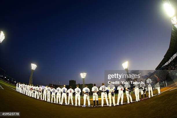 Members of the MLB All-Stars are seen on the base path before the game against Samurai Japan at Okinawa Cellular Stadium during the Japan All-Star...