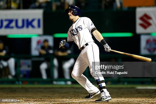 Evan Longoria of the Tampa Bay Rays hits a home run in the fifth inning against Samurai Japan during the game at Okinawa Cellular Stadium during the...