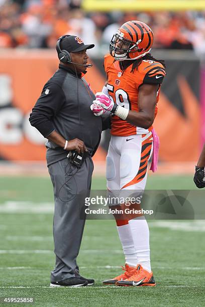 Head Coach Marvin Lewis of the Cincinnati Bengals talks with Emmanuel Lamur during the game against the Carolina Panthers at Paul Brown Stadium on...
