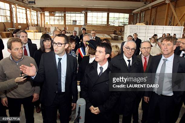 French Prime minister Manuel Valls flanked by Martin Malvy, the president of Midi-Pyrenees region listens to explanations as he visits Pyrenees...