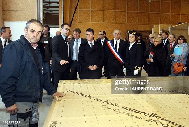 French Prime minister Manuel Valls flanked by Agos-Vidalos Mayor Jean-Marc Abbadie and the Hautes-Pyrenees department's prefect, , Anne-Gaelle...