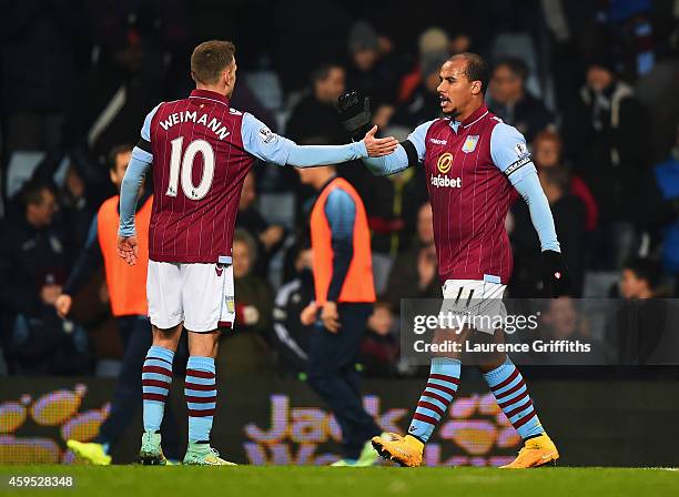 Gabriel Agbonlahor of Aston Villa celebrates with Andreas Weimann as he scores their first goal during the Barclays Premier League match between...