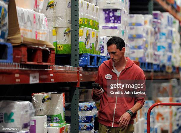 Team Leader Jimmy Willis pulls merchandise fro the back to stock the shelves November 24, 2014 at the Glendale Target. The Glendale Target store...