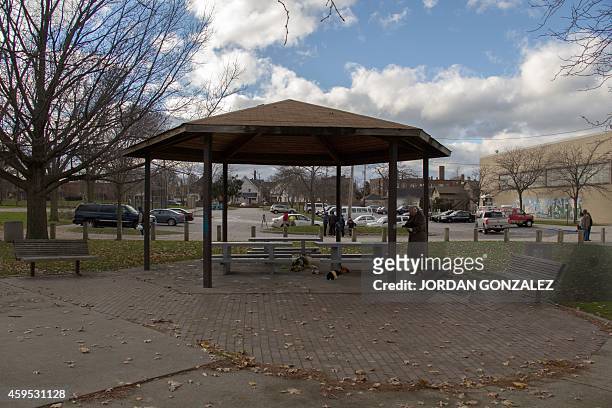 An unidentified person at Cudell Commons Park in Cleveland, Ohio, November 24, 2014 stands under a gazebo where a memorial was set up for Tamir Rice,...