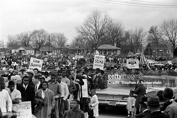 Snaking line of Selma to Montgomery civil rights marchers forming on grounds of the City of St. Jude school, prior to marching to the state capital...