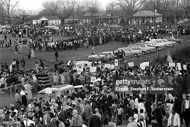 Snaking line of Selma to Montgomery civil rights marchers forming on grounds of the City of St. Jude school, prior to marching to the state capital...