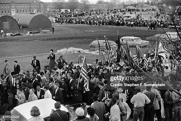 Front of Selma to Montgomery, Alabama civil rights march leaving City of St. Jude school grounds. Dr. King and wife Coretta in front surrounded by...