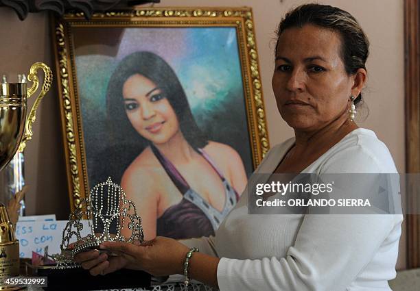 Teresa Munoz, mother of murdered Miss Honduras World, Maria Jose Alvarado, shows her daughter's crown at her house in Santa Barbara, 200 km northwest...
