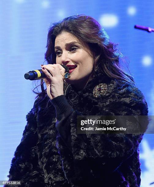 Idina Menzel performs at the 2014 Bloomingdale's Holiday Window Unveiling at Bloomingdale's 59th Street Store on November 24, 2014 in New York City.