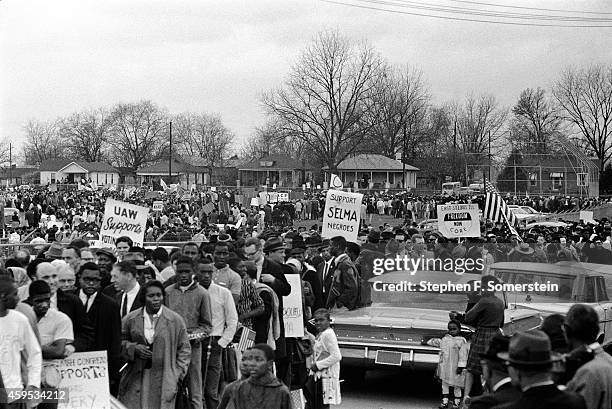 Snaking line of Selma to Montgomery civil rights marchers forming on grounds of the City of St. Jude school, prior to marching to the state capital...
