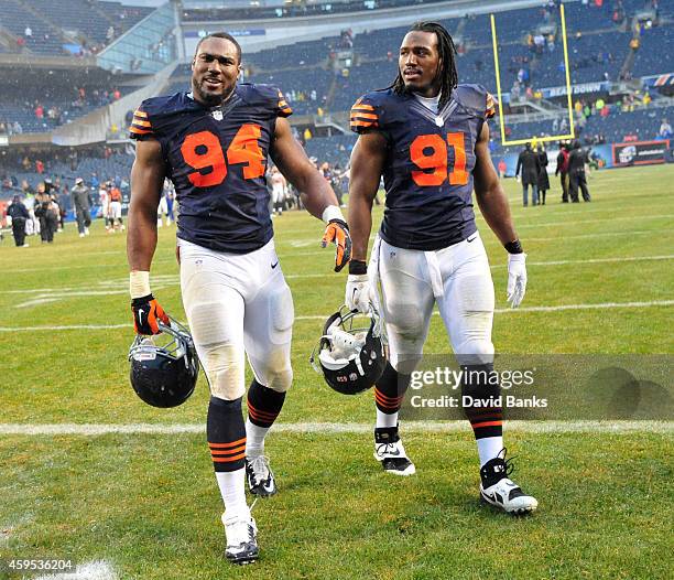 Cornelius Washington of the Chicago Bears and David Bass of the Chicago Bears leave the field after the game against the Tampa Bay Buccaneers on...