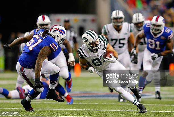DDETROIT, MI Eric Decker of the New York Jets looks to avoid the tackle by Brandon Spikes of the Buffalo Bills in the second quarter at Ford Field on...