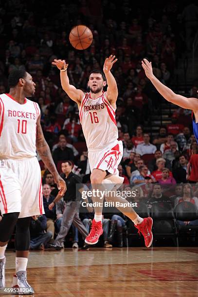 Kostas Papanikolaou of the Houston Rockets passes the ball against the New York Knicks during the game on November 24, 2014 at the Toyota Center in...