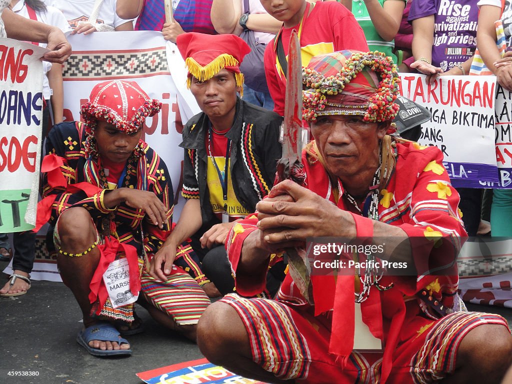 A 'datu' (tribal leader) from Mindanao poses with a knife...