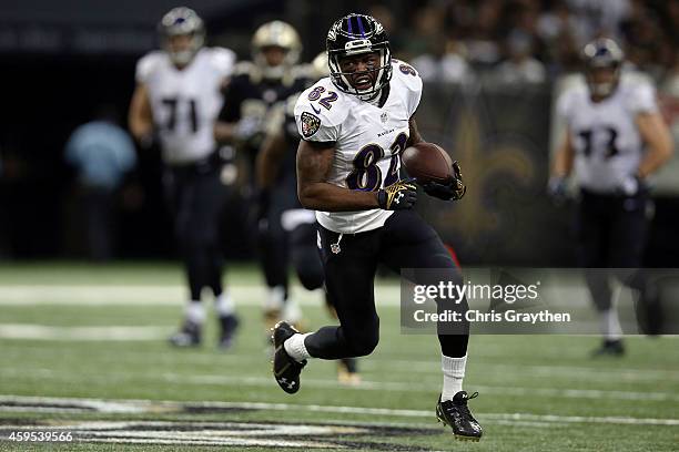 Torrey Smith of the Baltimore Ravens runs for yards during the second quarter of a game against the New Orleans Saints at the Mercedes-Benz Superdome...